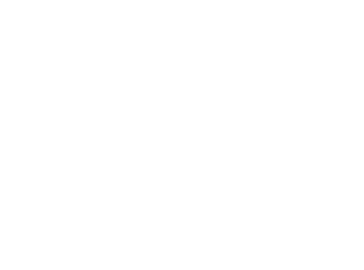 people sitting on chair in front of table while holding pens during daytime